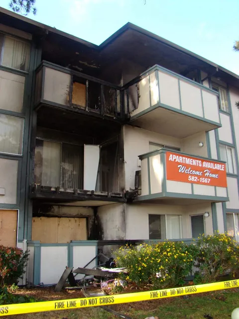 exterior view of apartment building with fire damage