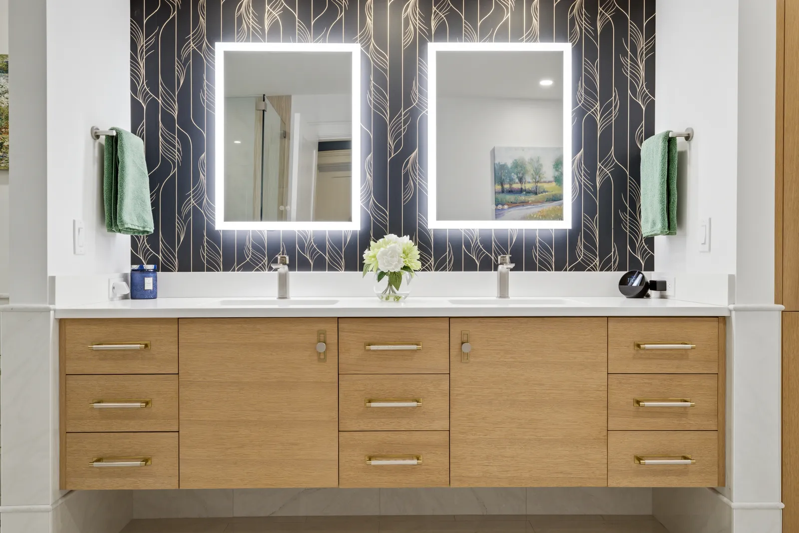 Rift sawn white oak floating double vanity with white quartz counter, dark botanical wallpaper, and two LED mirrors in Braintree.