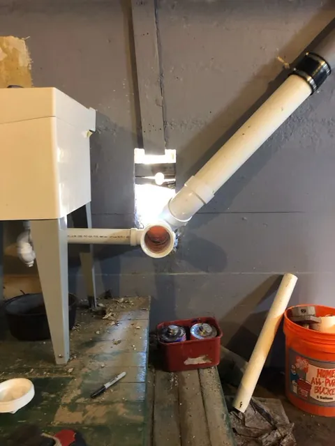 Utility sink and drain pipe installation