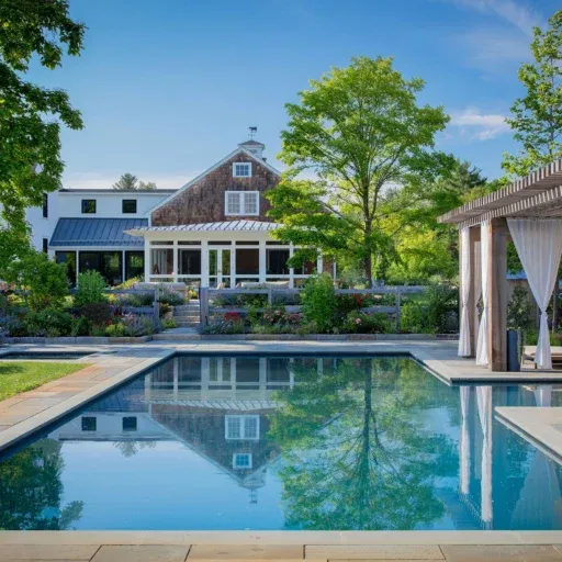 This Carlisle pool and cedar pergola landscape frames outdoor dining, shade, and poolside relaxation within a cohesive backyard design.