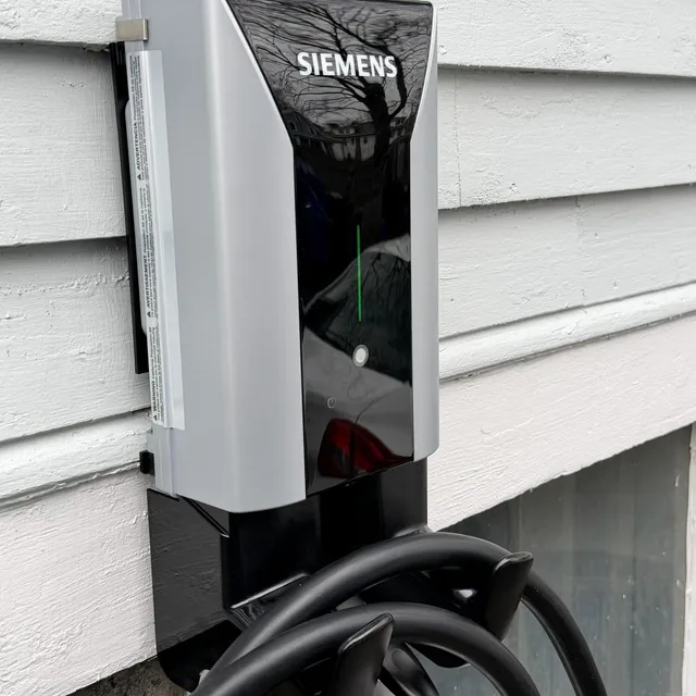 Boston Light & Power electrician installing a Siemens Level 2 EV charger in Milton, MA.