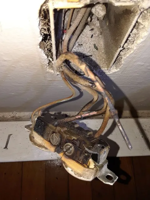 Burned-out receptacle removed during a repair