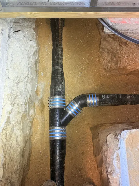 New underground waste line with banded couplings