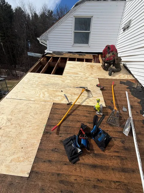 New sheathing boards being installed