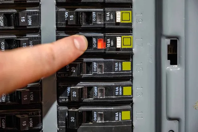 Circuit breaker panel showing a tripped breaker for circuit number seventeen.