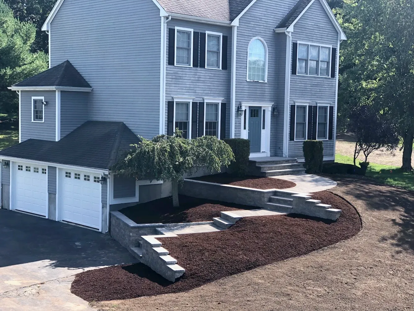 Paver walkway, with stone stops and retaining wall. In Southeastern Massachusetts