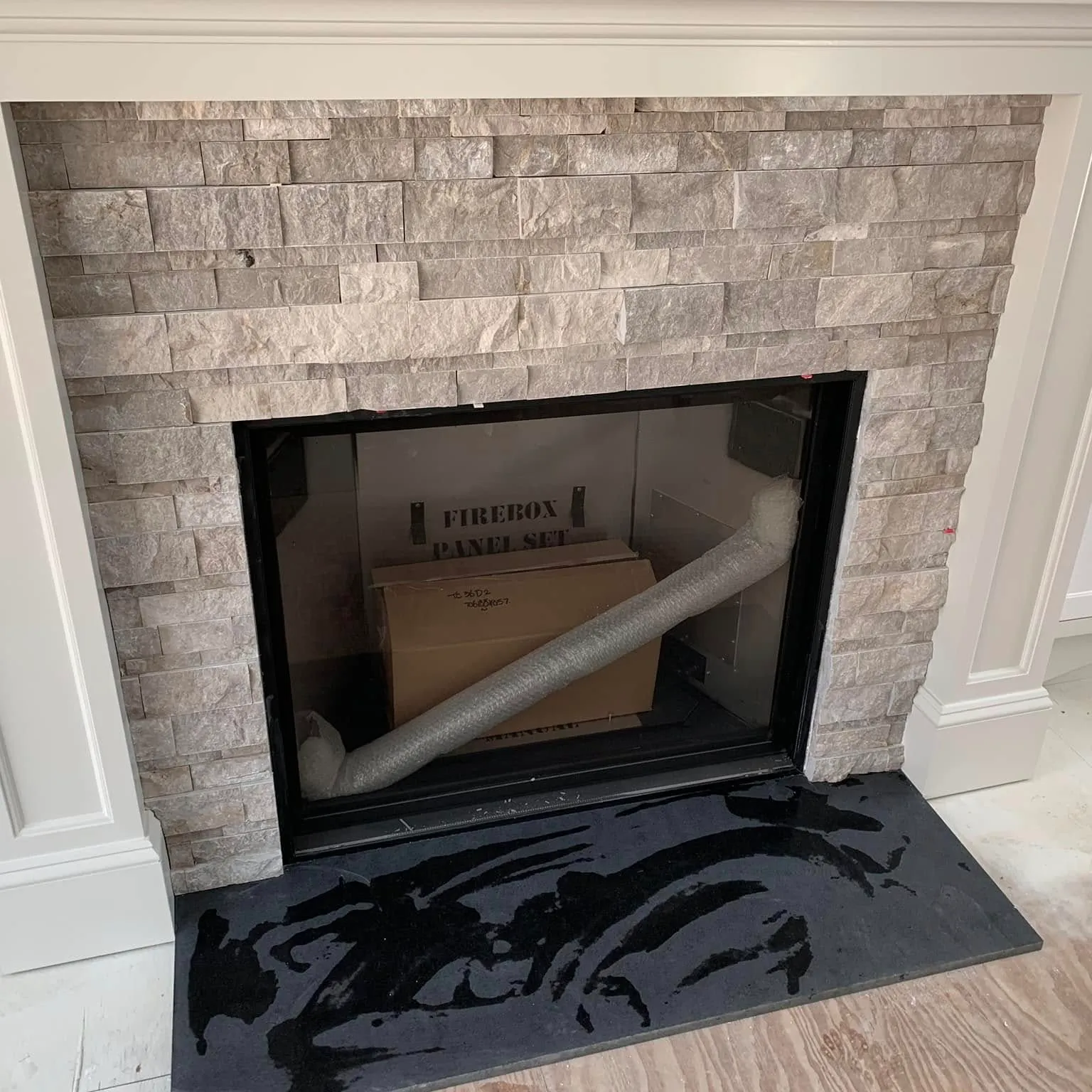 Stone tile fireplace surround and hearth