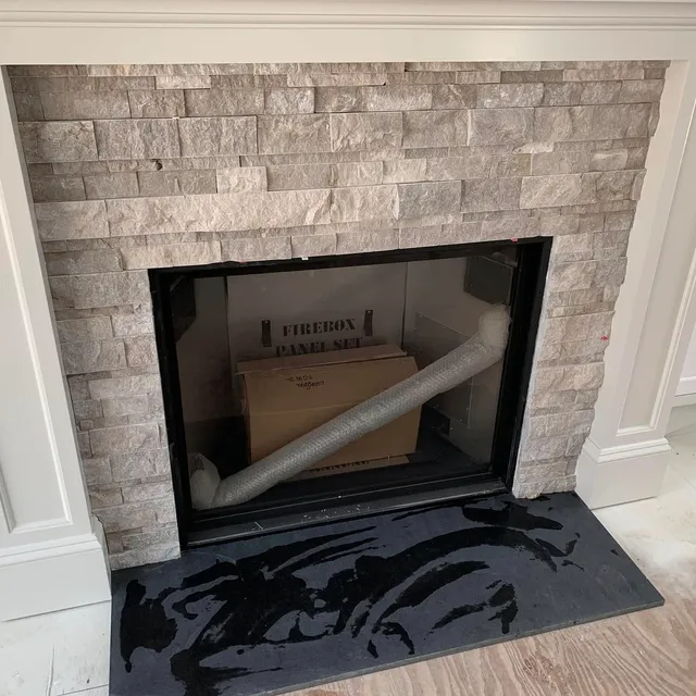 Stone tile fireplace surround and hearth
