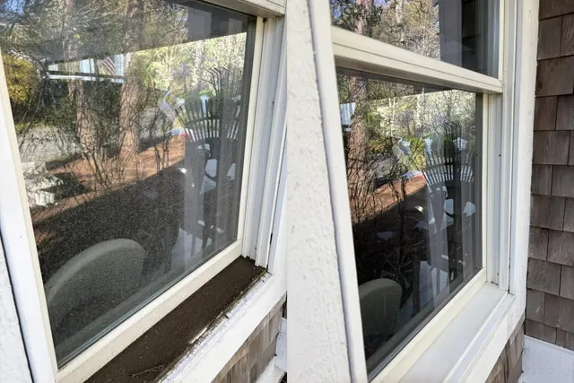 Exterior window cleaning before and after pollen dust and grime removed from glass and sill Plymouth Massachusetts