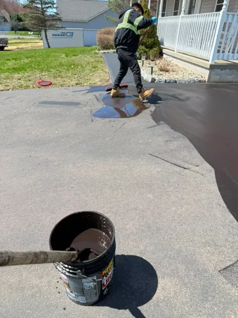 Asphalt maintenance work on a Massachusetts property