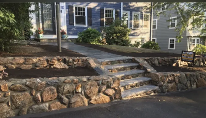 Fieldstone retaining wall granite steps. Newton,MA.