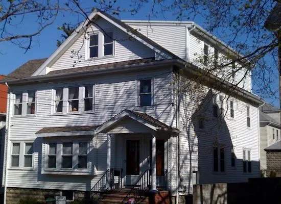 Completed dormer addition on a three-decker