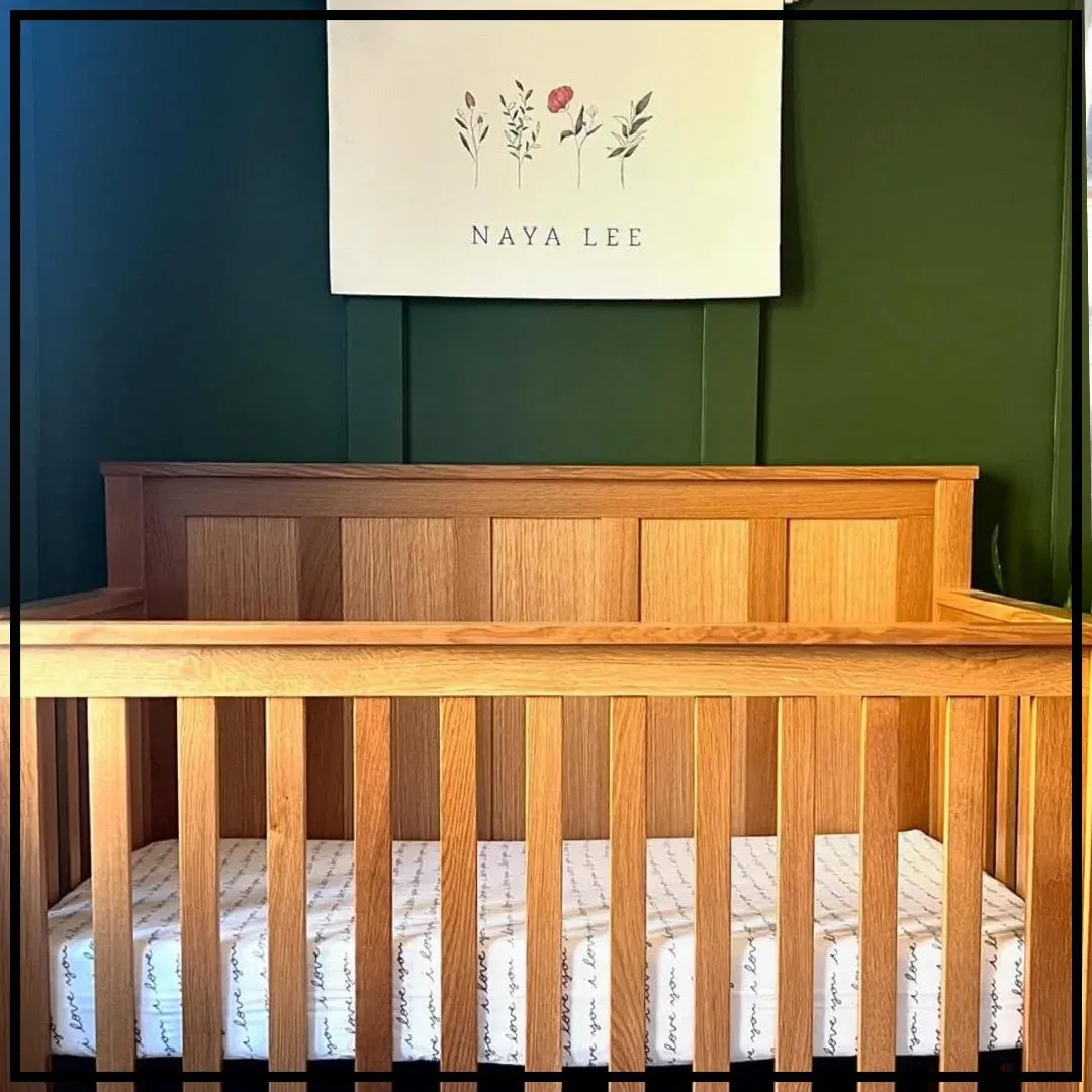 A custom oak baby crib