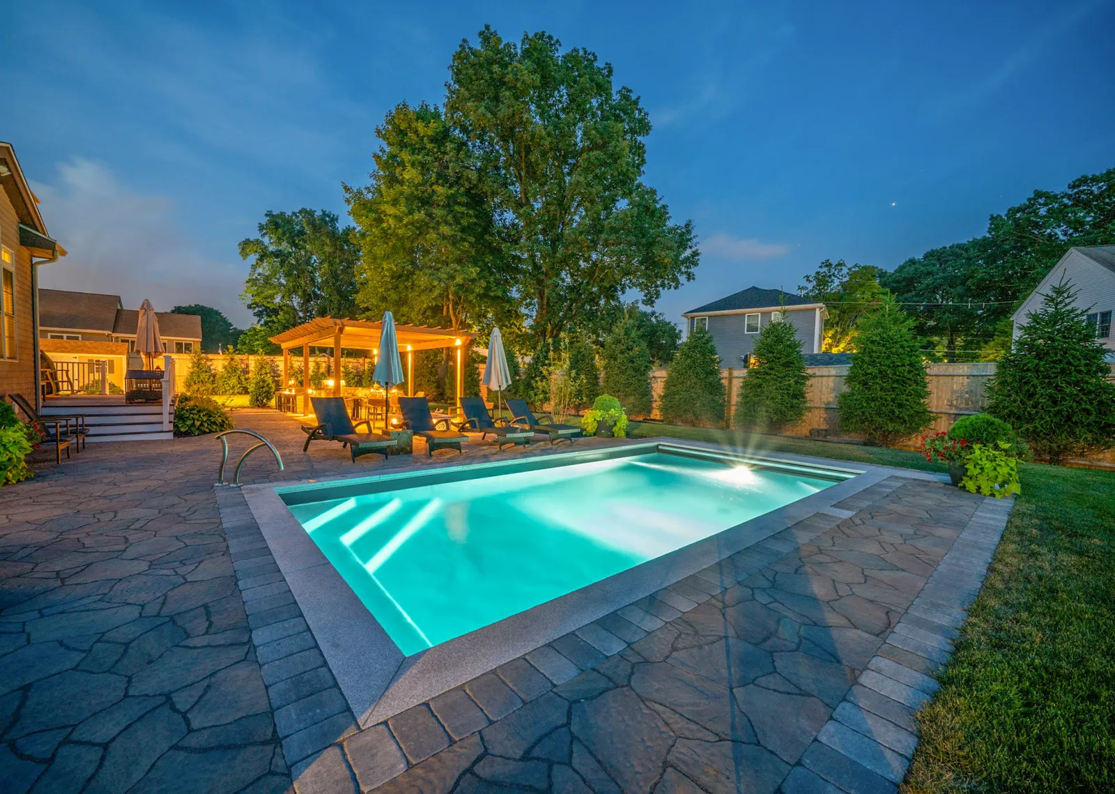 Pool, backyard, night time, patio, pavers, pool lights