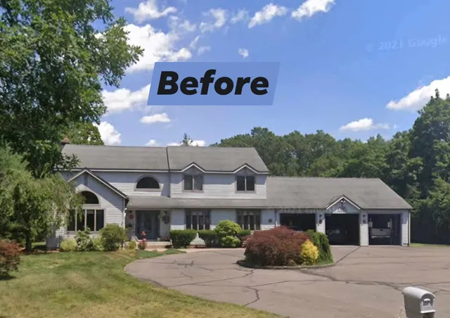 A large two-story house before renovation on a sunny day.