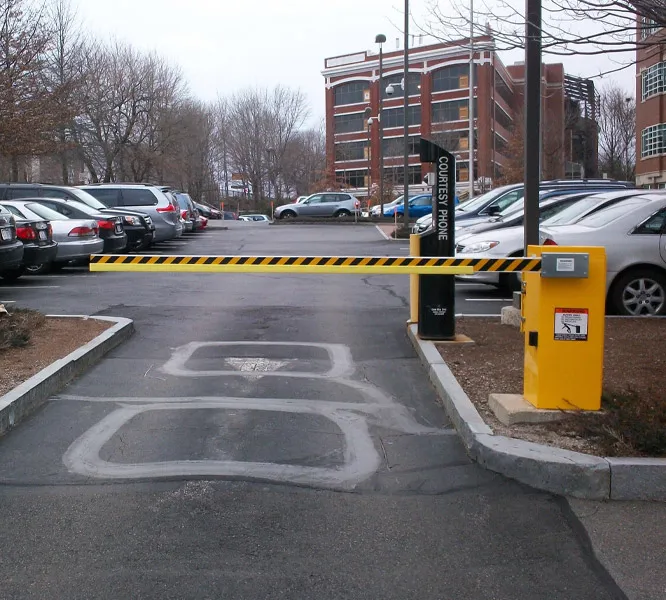 Barrier gate controlling access to a parking lot
