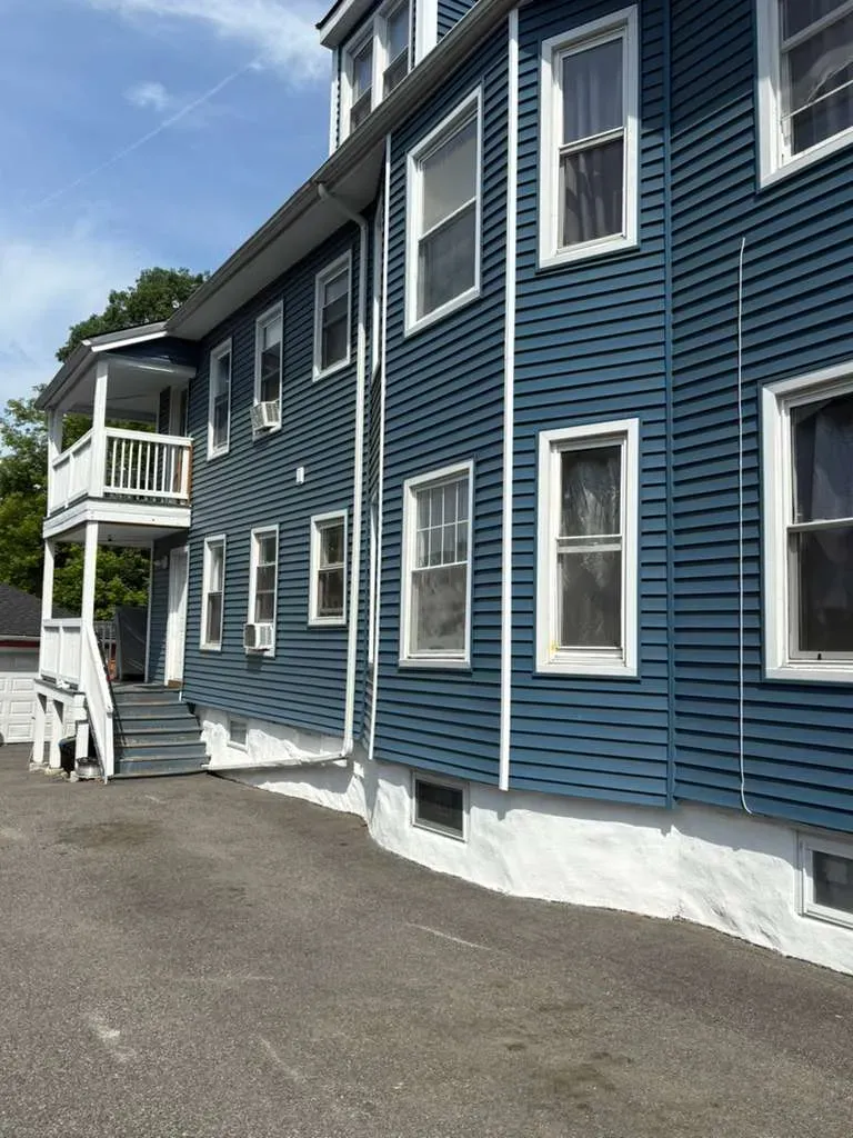 Top Tier Construction crew on a roofing job in Massachusetts