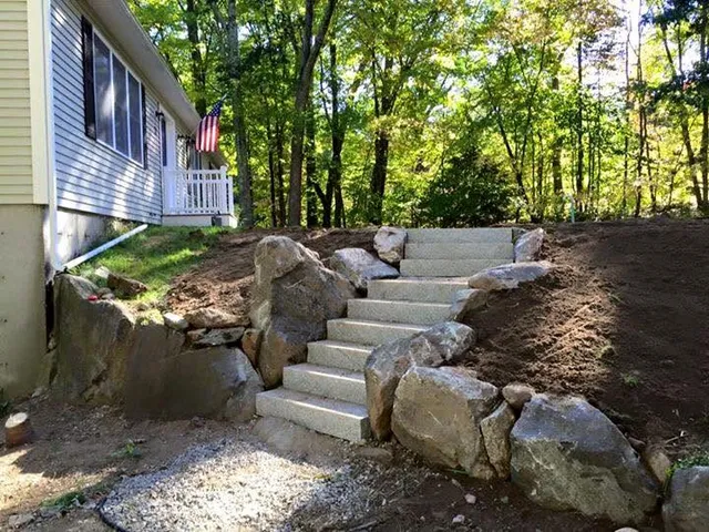 Granite steps with boulder retaining wall