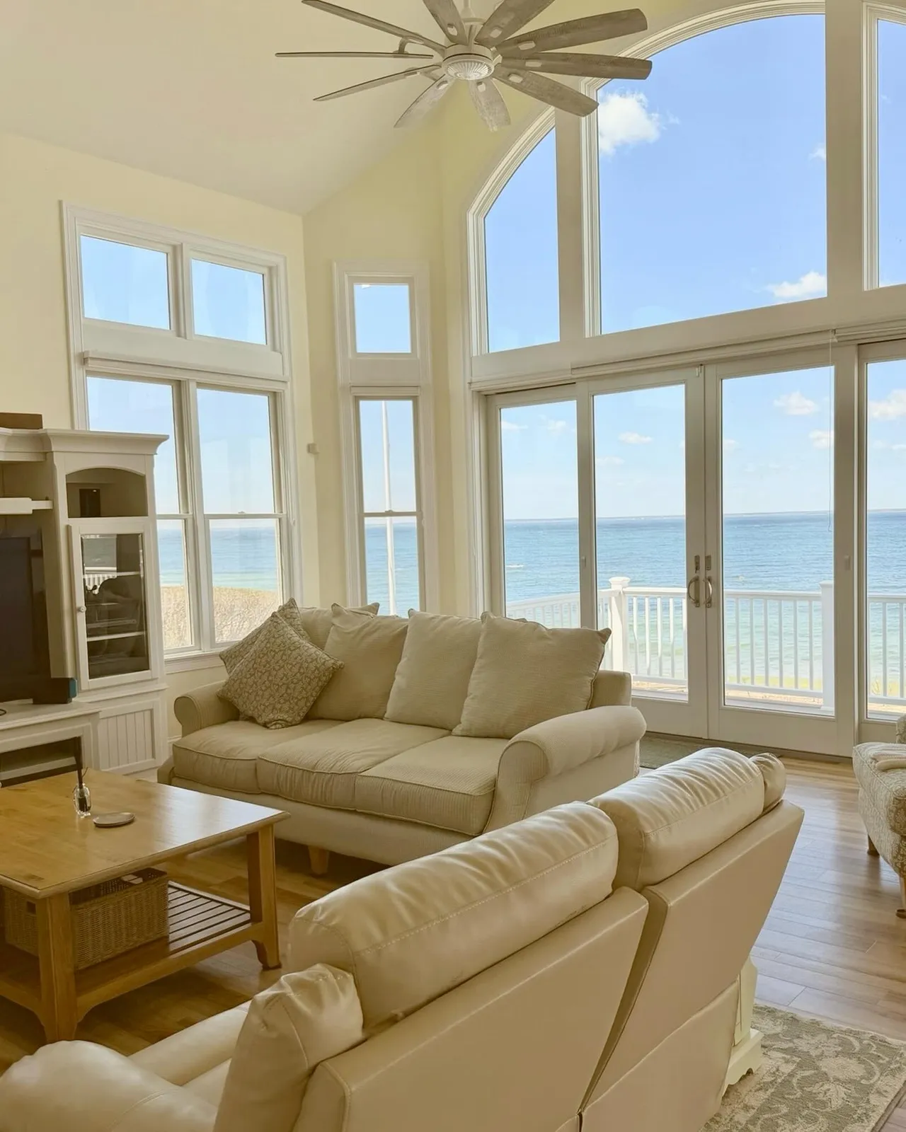 Bright, carefully maintained living room overlooking the water