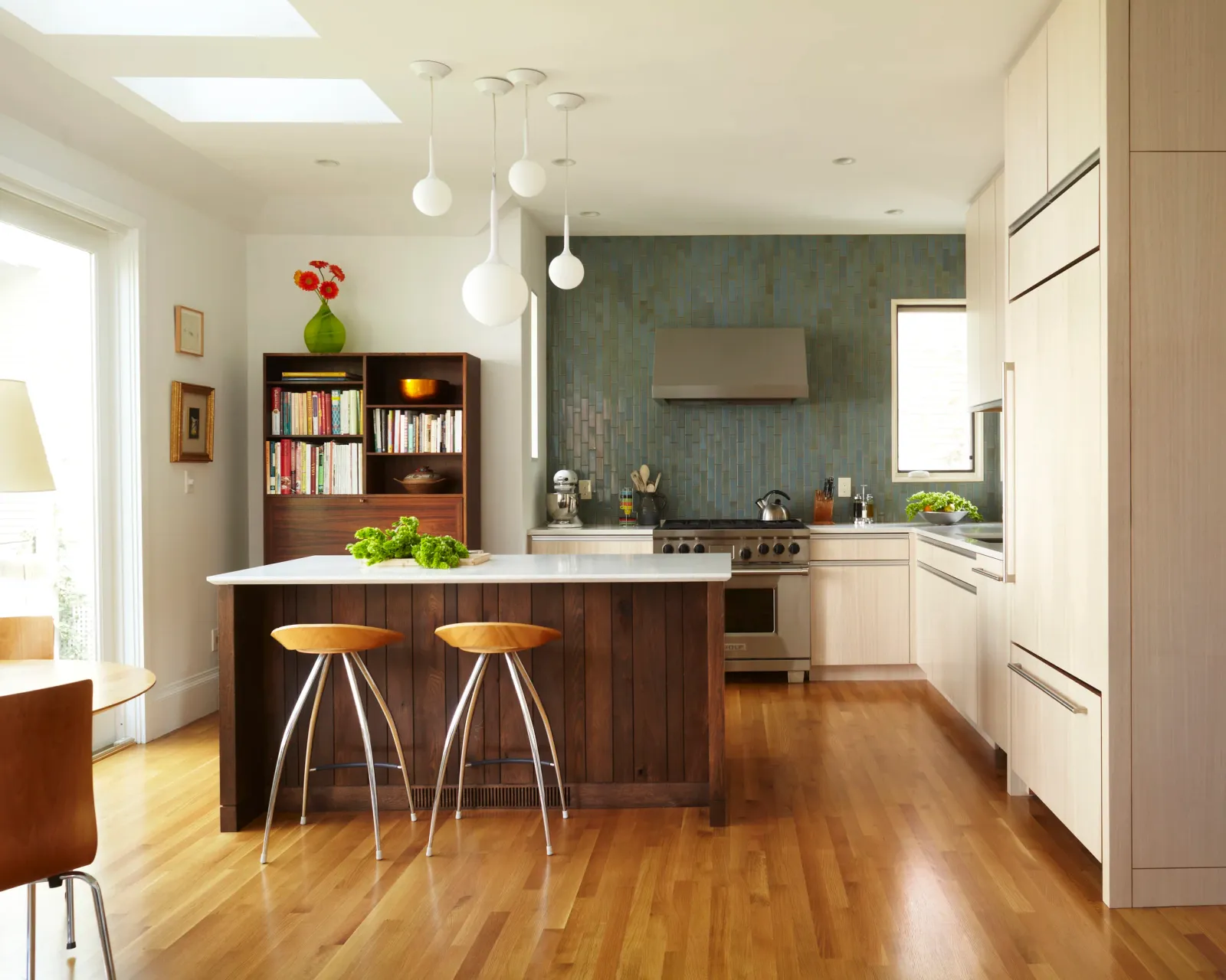 Open kitchen with walnut island, skylights and custom cabinetry