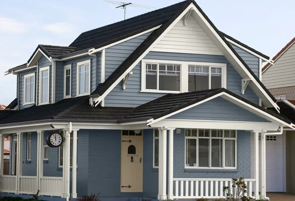 Completed blue craftsman-style home exterior
