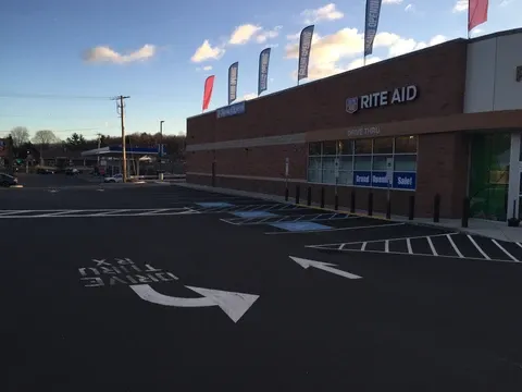 Rite Aid store, parking lot with disabled spots, drive-thru Rx