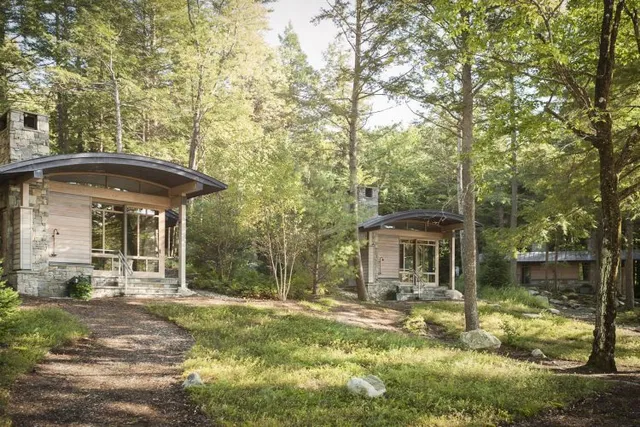 Modern, eco-friendly homes nestled among serene woodland in Maine.