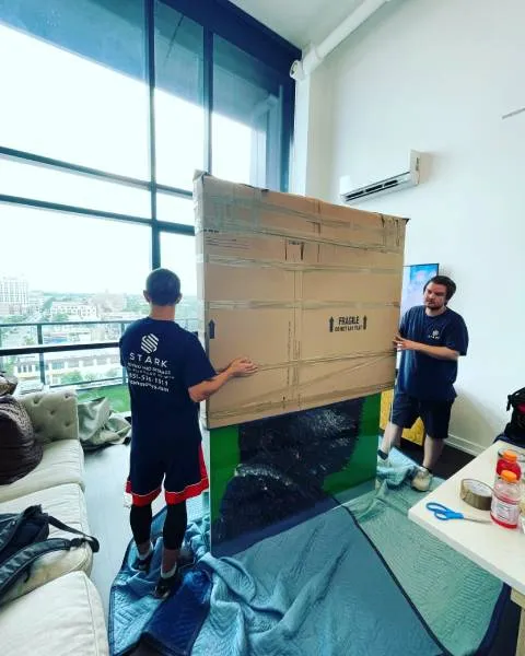 big artwork being packed and moved