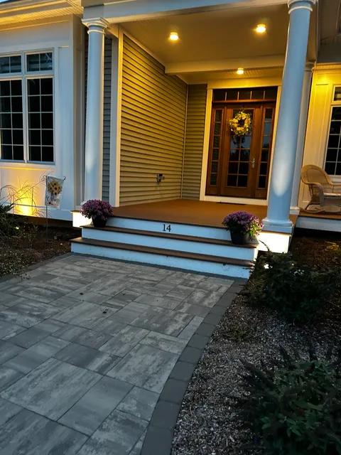 Front porch illuminated after dark
