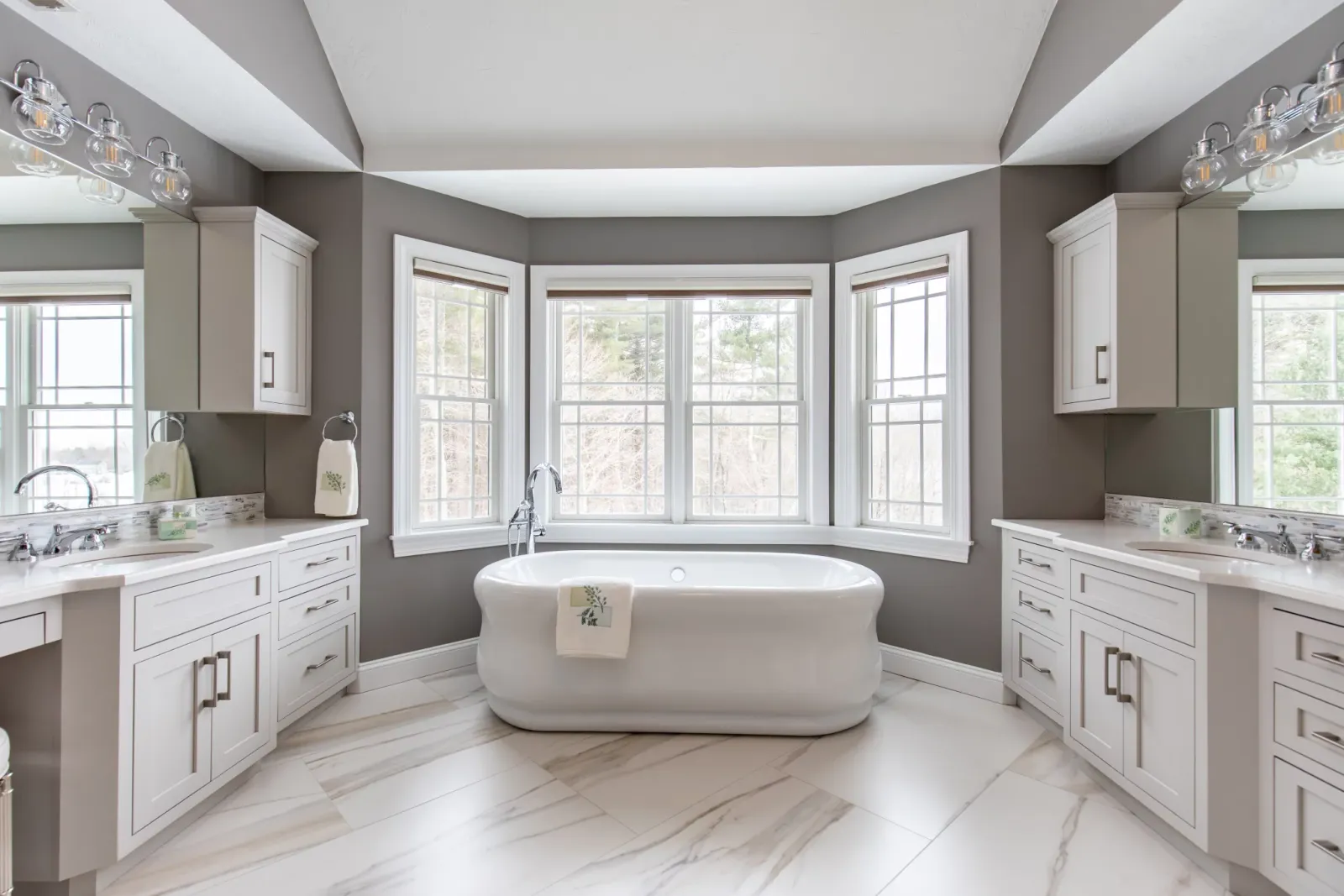 An expansive bathroom showcasing a bathtub alongside a sleek sink.