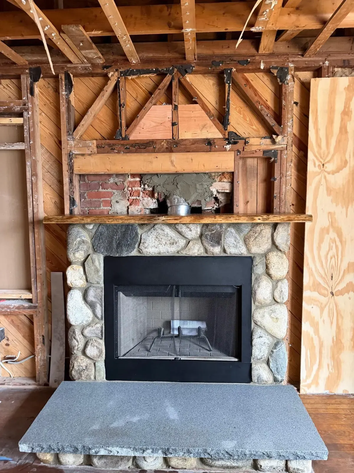 Interior fieldstone fireplace — restored — Chimney Goat, Boston MA