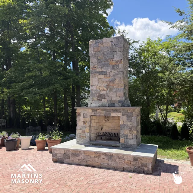 A custom fireplace can completely change the feel of an outdoor space. It becomes the place where family and friends naturally gather, creating memories that last for years.

For this project, we used Thompson Stone Brooklawn Blend Strip Stone Veneer paired with Bluestone to create a timeless design that complements the home while standing up to New England weather.

We love bringing projects like this to life and creating outdoor spaces our clients can enjoy for many years to come.

#MartinsMasonry #OutdoorFireplace #NaturalStone