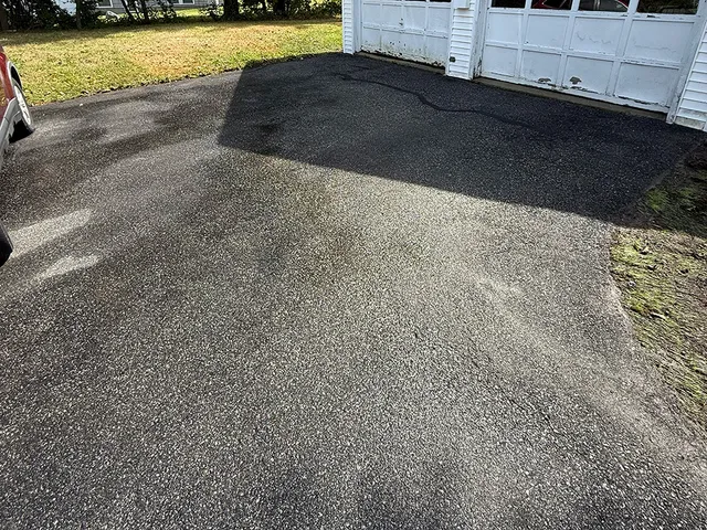 Driveway after pressure washing company came in Portland, Maine.