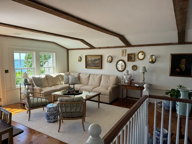 Restored living room with beamed ceiling