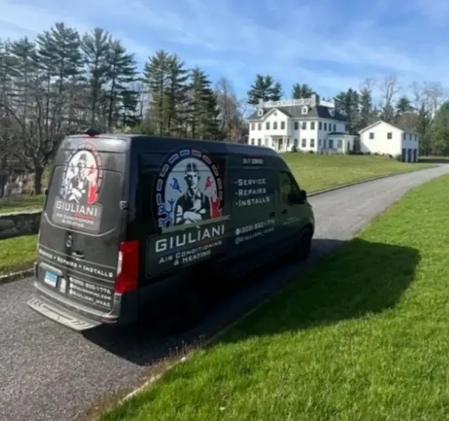 Giuliani Air Conditioning & Heating service van in Greenwich CT driveway