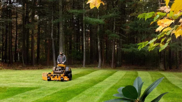 H&H Landscape mowing a beautiful, well manicured lawn
