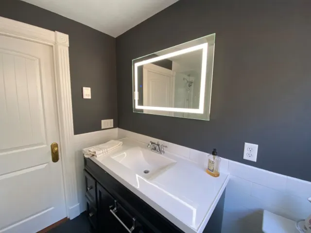 Contemporary Bathroom Remodeling With White Subway Tile Wainscoting - HRH Construction