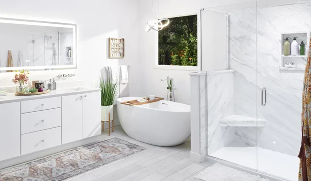 Re-Bath's Volakas Contemporary bathroom design featuring a bathroom vanity with two sinks. The vanity has a light wood finish with a gray countertop, two rectangular white ceramic sinks, each with a chrome faucet.