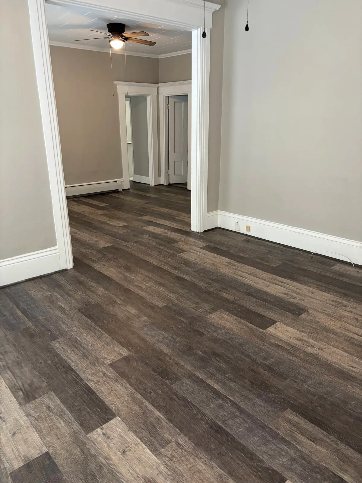 luxury vinyl flooring, new floor, floor installation, baseboard,