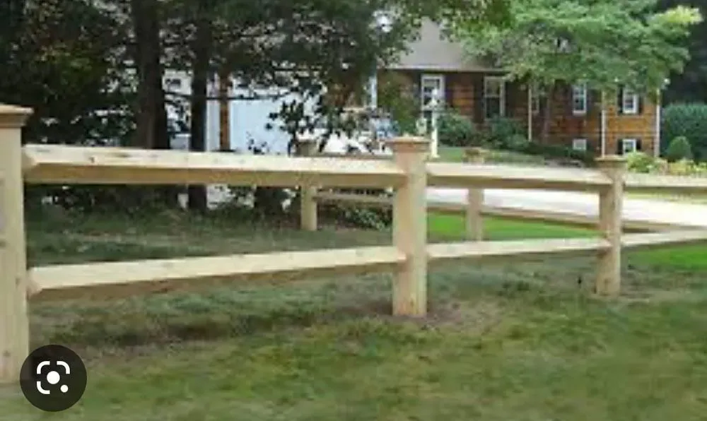 House with yellow fence.