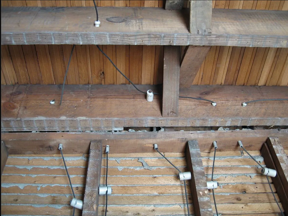 Wiring and lighting run across exposed beams