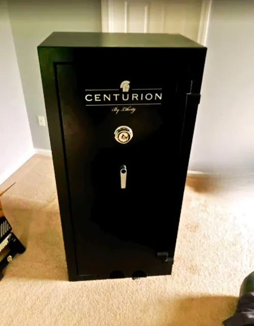 Photo of a gun safe being moved.