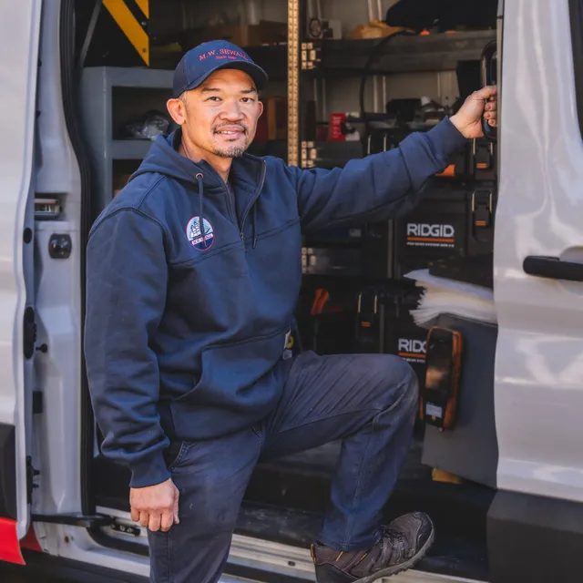 M.W. Sewall expert service technician performing a high-efficiency boiler tune-up in Maine.