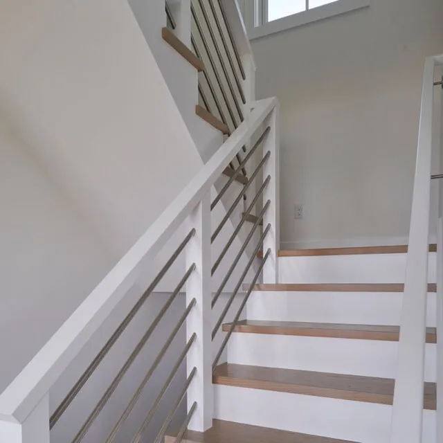 Contemporary and traditional Cape Cod styles blended in this staircase