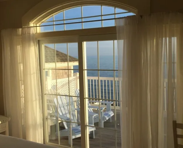 glass siding door facing beach