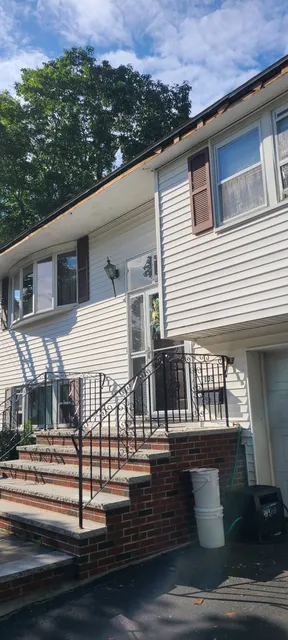 Fascia damage on split-level home before repair