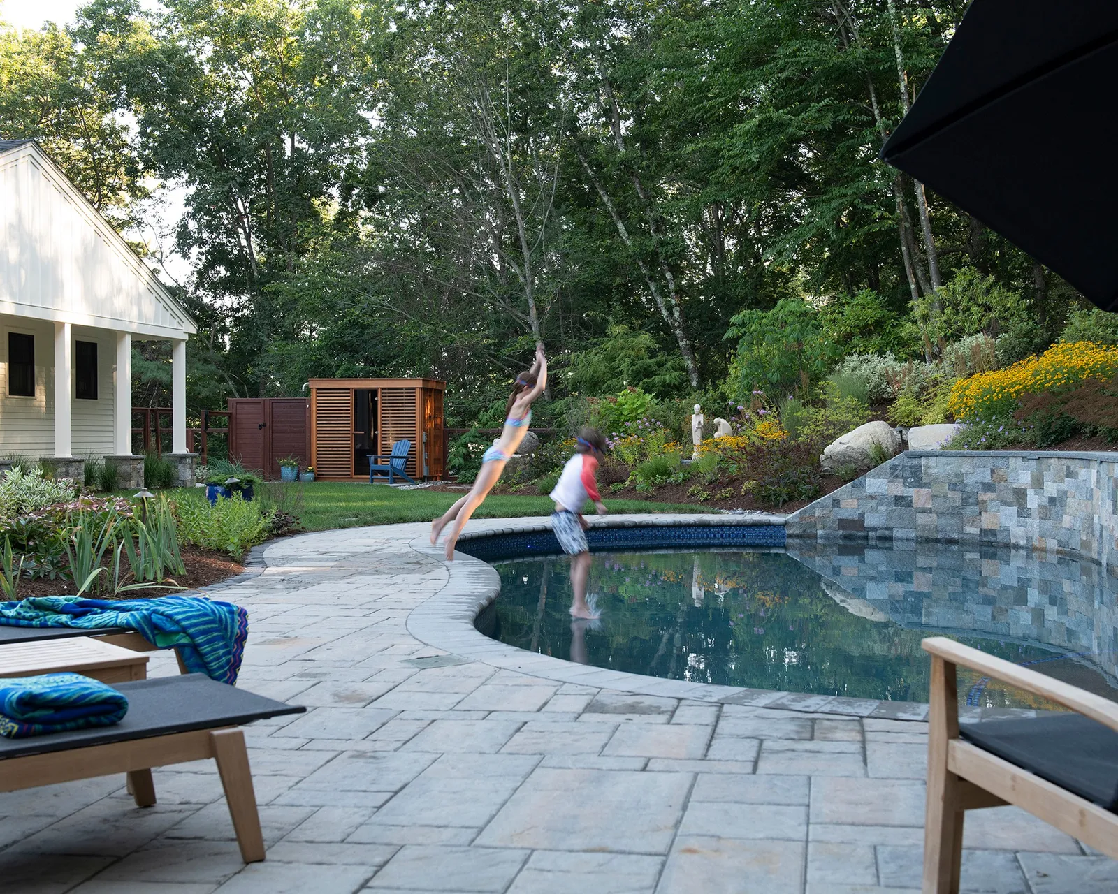 Summer days are better when you can jump right in!  We designed this backyard oasis for making the most of summer, with plenty of room to swim, play, relax, and enjoy the garden. 

The pool is tucked beautifully into the landscape, with a Techo-Bloc paved terrace and lush perennial gardens that transition the yard into the surrounding woodlands. And we love how the pool feels like a natural extension of the garden rather than something separate from it. A pretty great spot to cool off on a hot summer afternoon!

@jhs_landscape_const 
@techobloc 
@saunafin_official 

#LandscapeArchiture #BackyardInspiration #TechoBloc #PoolDesign #AngieVergeLandscapeDesign