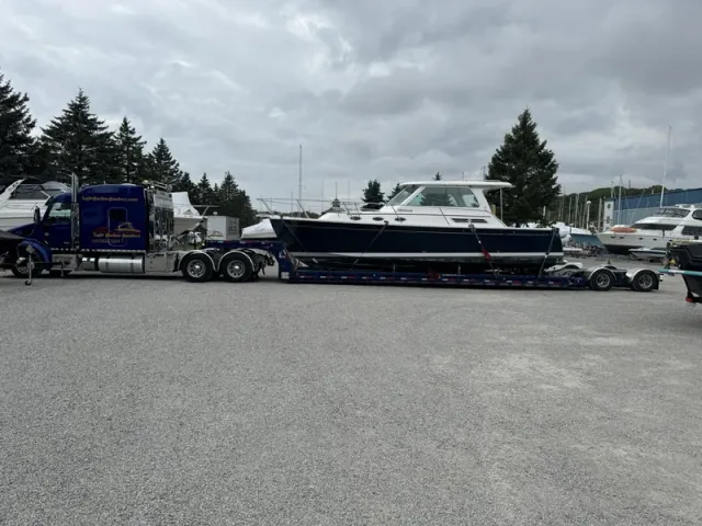 Boat transport of a Back Cove 31 motor yacht on a specialized Waltron low boy style yacht transport trailer