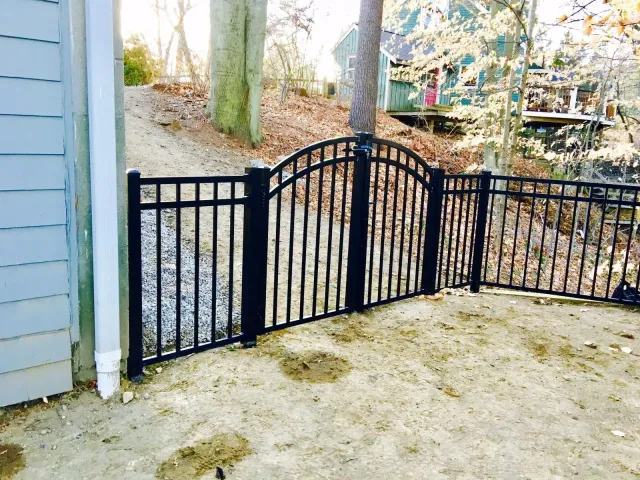 Black aluminum fence around a property