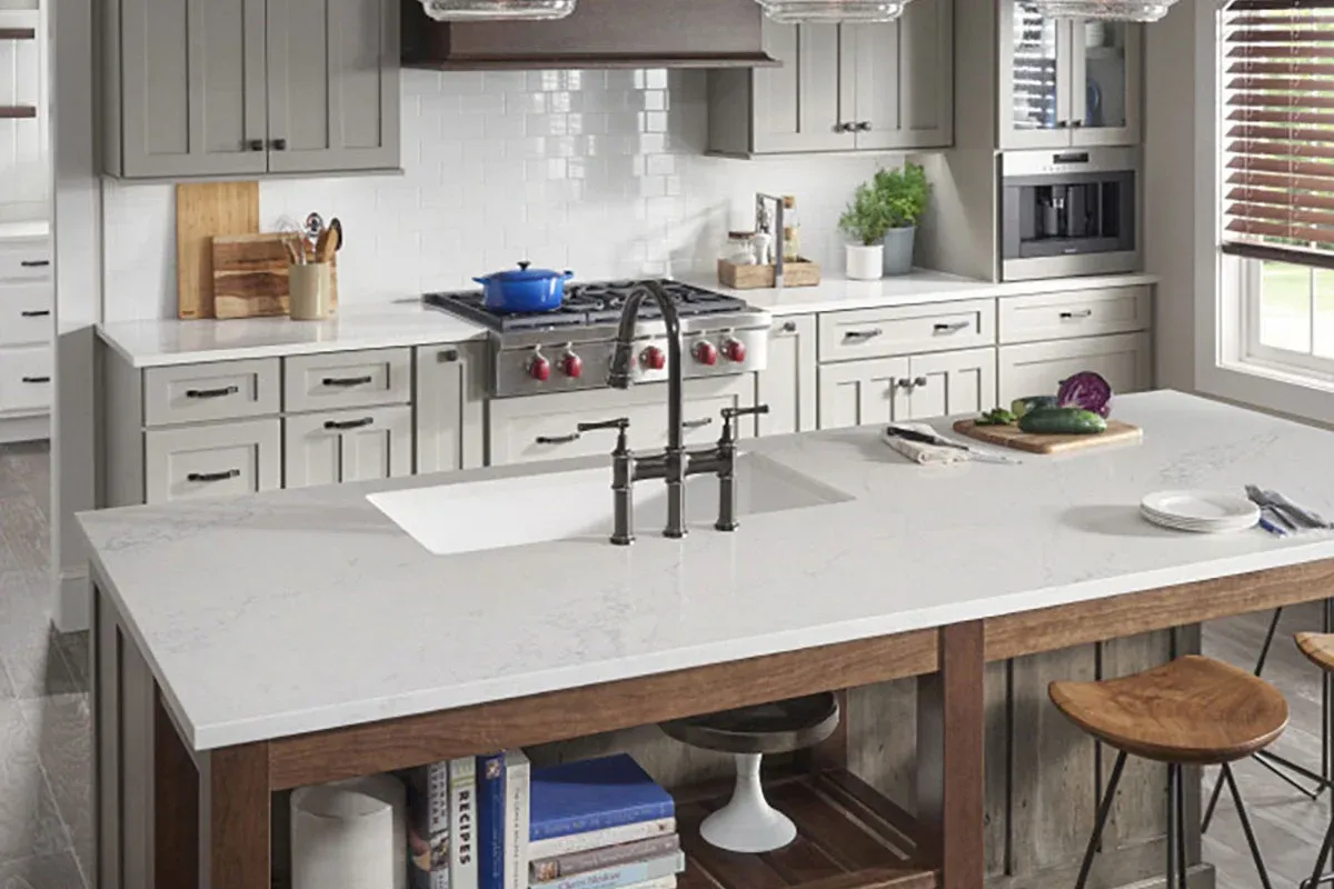 Contemporary kitchen with white cabinetry and quartz island countertop